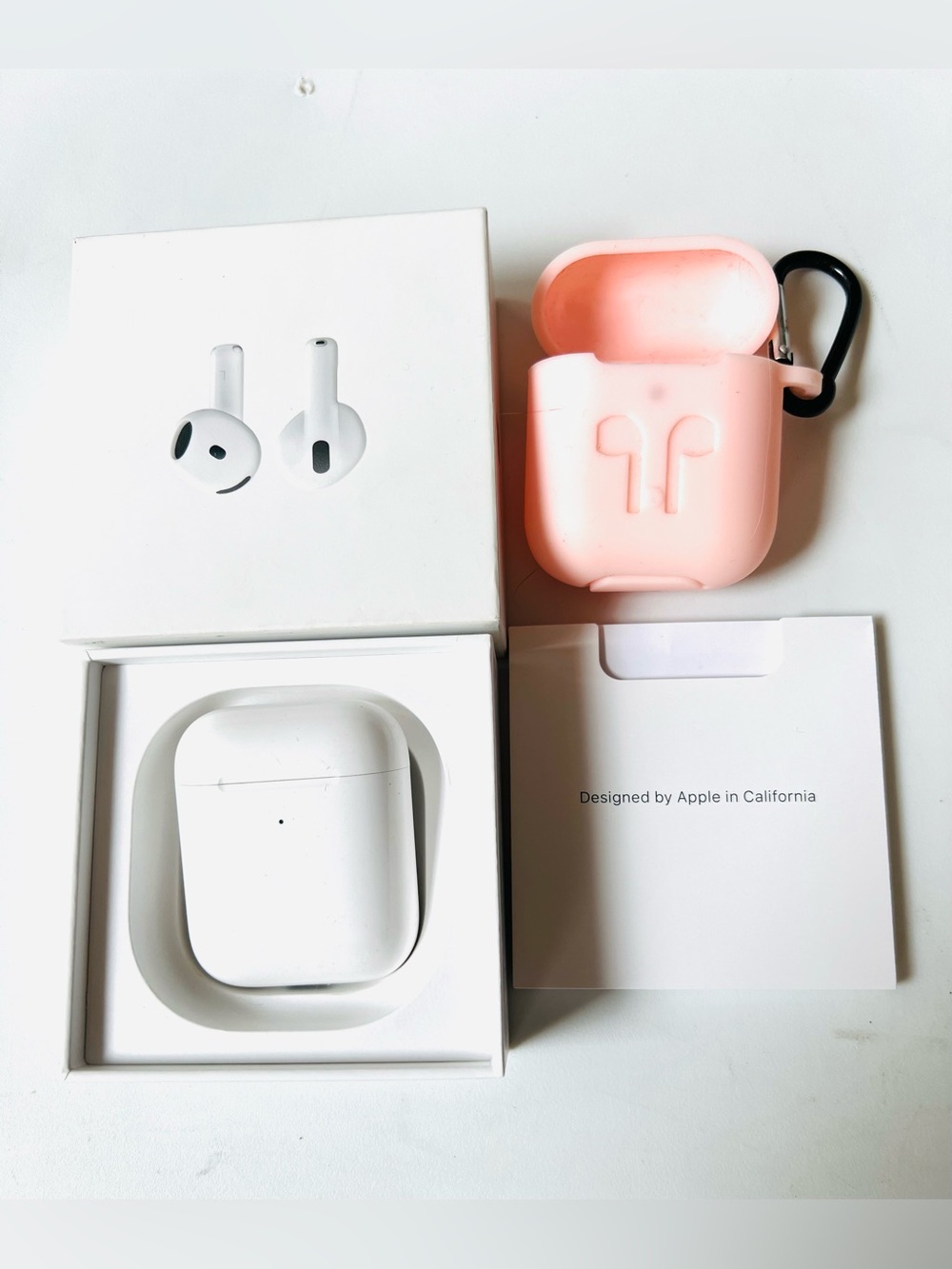Apple White AirPods with Pink Silicone Case and Carabiner